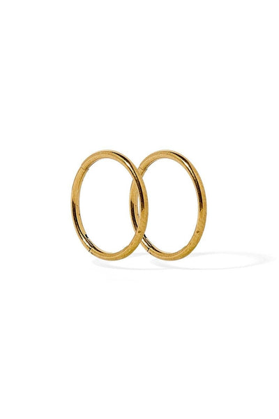 Two gold hoop earrings on a white background