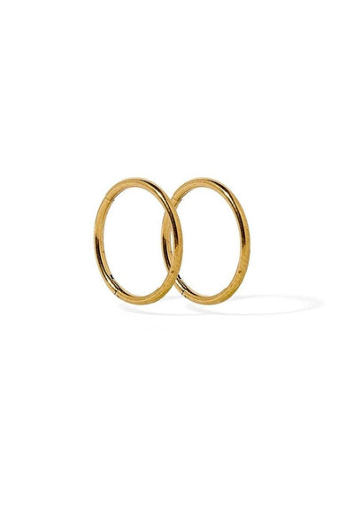 Two gold rings stacked on a white background