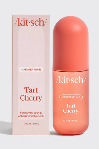 Kit-sch Tart Cherry hair perfume bottle and packaging on a light gray background