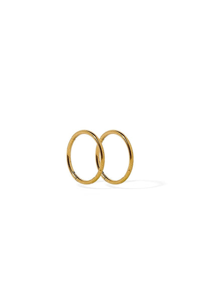 Two gold hoop earrings on a white background