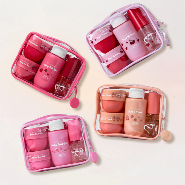 Set of pink skincare products in transparent travel cases on a light beige background