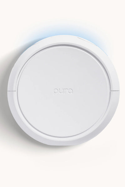 Round white device with 'aura' branding on a light gray background